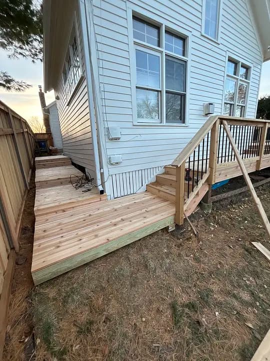 Modern deck with black metal railing